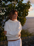 The Heart Hoodie in Ivory, front, on the island